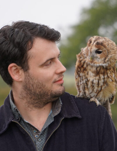 Visitor with owl on his shoulder