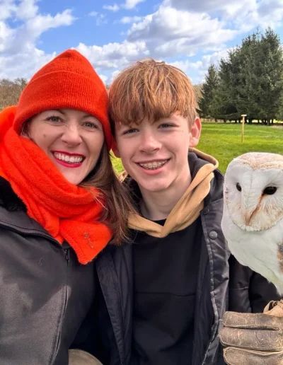 Mother and son with July;iet the Barn Owl on their falconry experience london